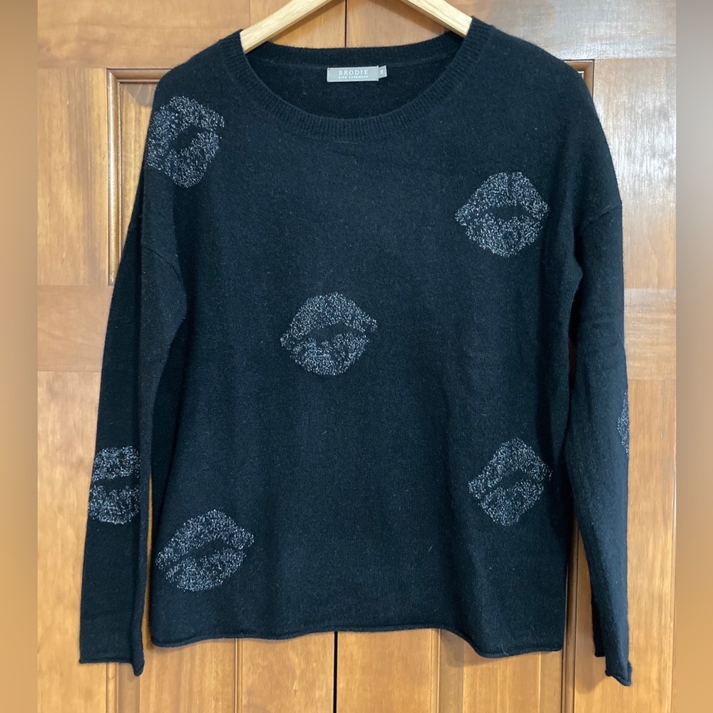 Brodie Cashmere Black Crewneck Sweater with Silver Lip Motif